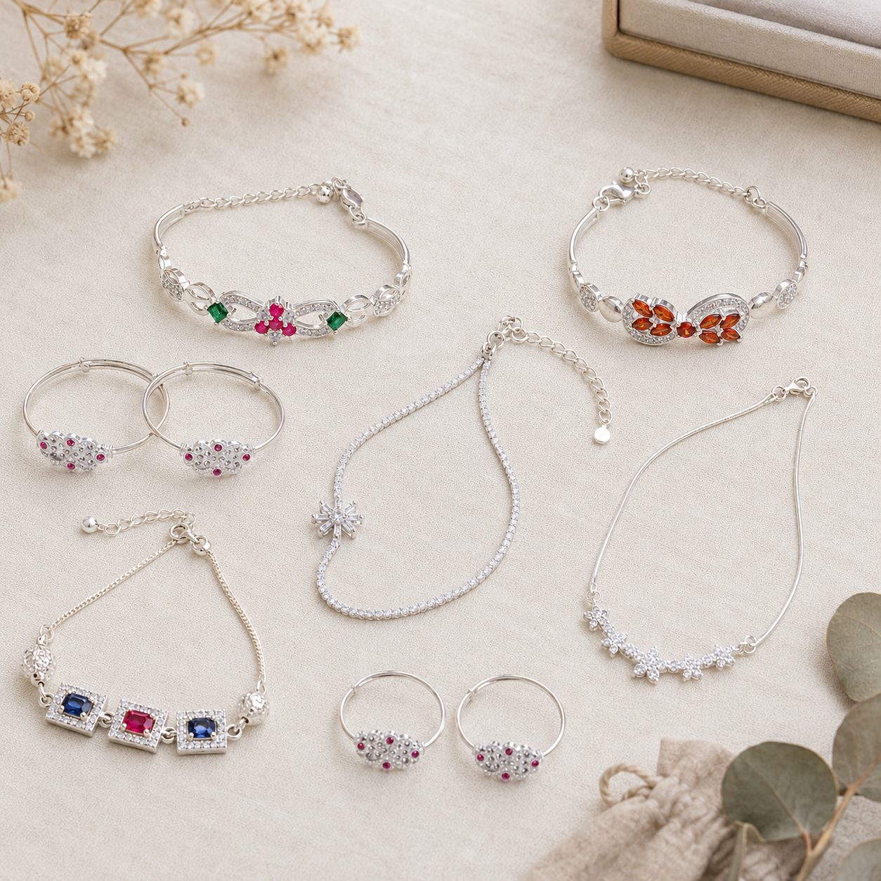 Six handmade silver pieces from my own shop, photographed on linen